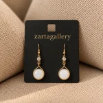 Elegant Gold Teardrop Earrings on Black Card 11zon